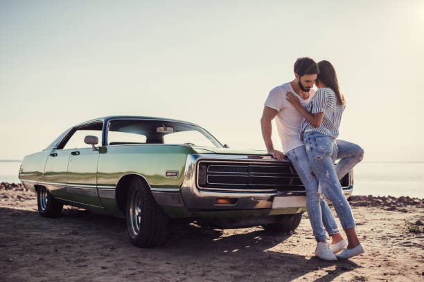 istock Couple with retro car 1007326028