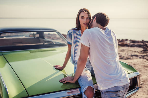istock Couple with retro car 1007326034