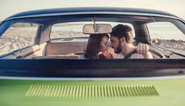 istock Couple with retro car 1007326174