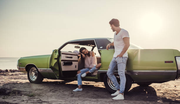 istock Couple with retro car 1007326286