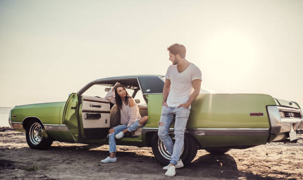 istock Couple with retro car 1007326296