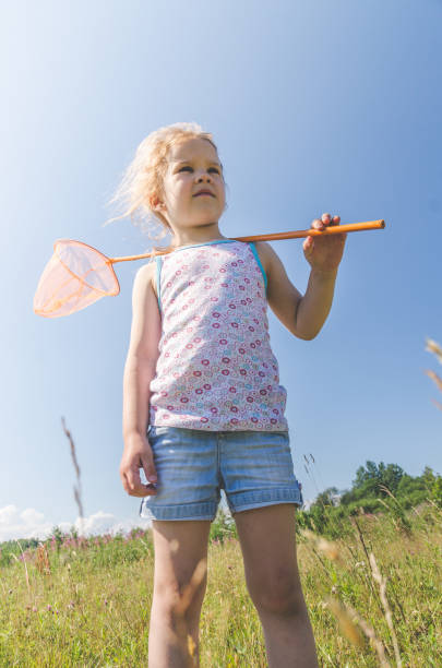 istock child with a net catches a butterfly 1007326530