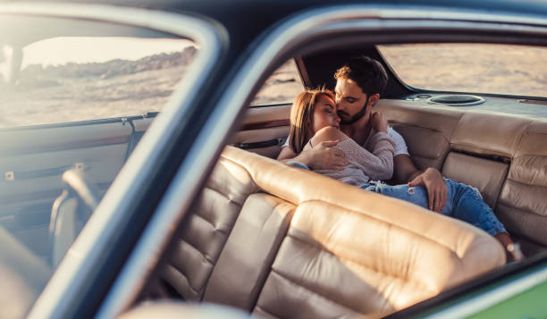 istock Couple with retro car 1007326570