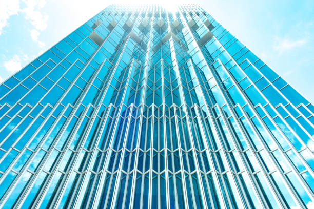 istock underside panoramic and perspective view to steel blue glass high rise building skyscrapers, business concept of successful industrial architecture 1007329278