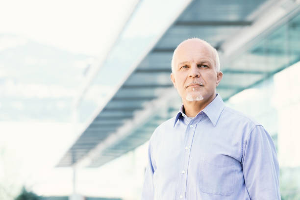 istock Low angle view of senior man looking off 1007335904