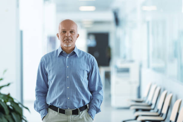 istock senior man standing and facing the camera with hands in pocket 1007335942