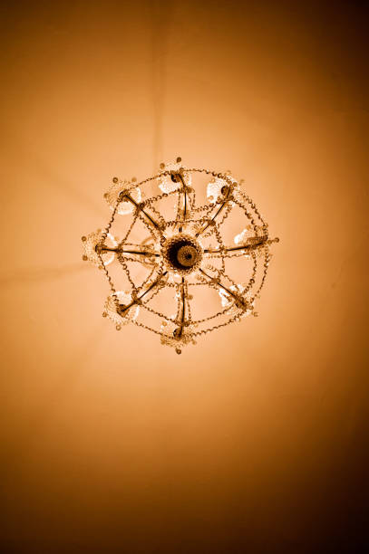 istock Colourful Sparkling Round Chandelier With Yellow-Orange Light 1007337068