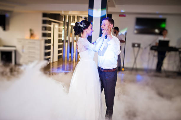istock Romantic newly married couple performing their first dance in the restaurant. 1007342298