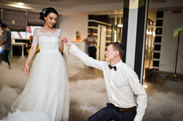 istock Romantic newly married couple performing their first dance in the restaurant. 1007342472
