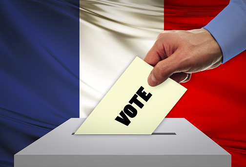 Man voting on elections in FRANCE front of flag