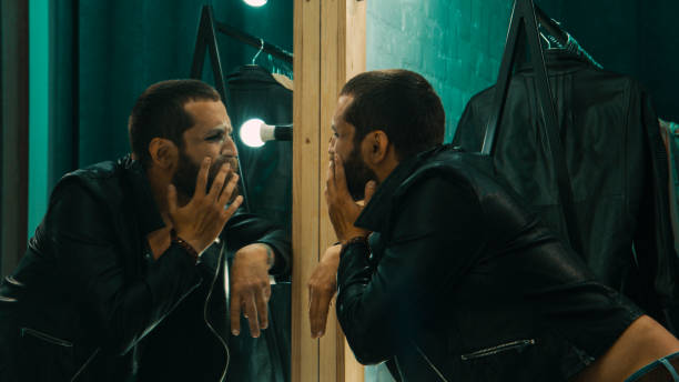 istock Rock singer taking drugs in dressing room 1007344990