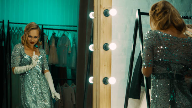 istock Expressive woman preparing for performance in dressing room 1007345348