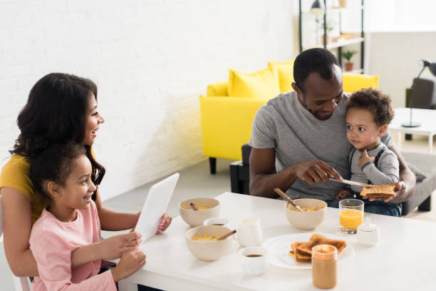 istock happy young family spending time together at kitchen 1007345696