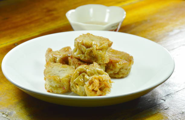istock crispy deep fried crab meat roll in flour dipping with plum sauce 1007355120