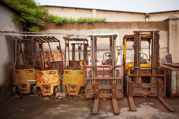 Many old electric forklift stackers stock photo