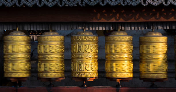 istock Buddhist prayer wheels rotating in motion. Kathmandu, Nepal 1007367182