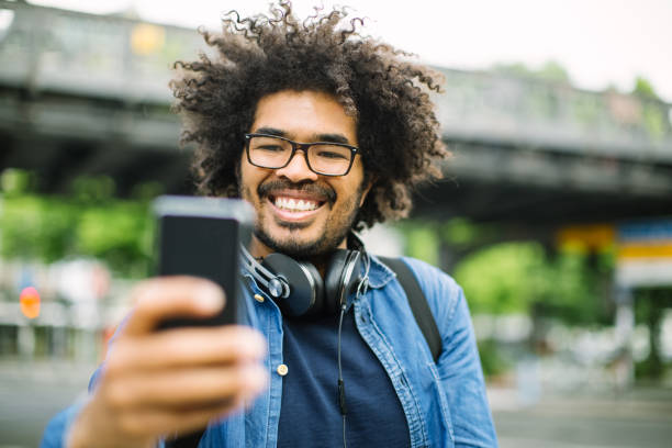 istock African man taking selfie outdoors on street 1007370760