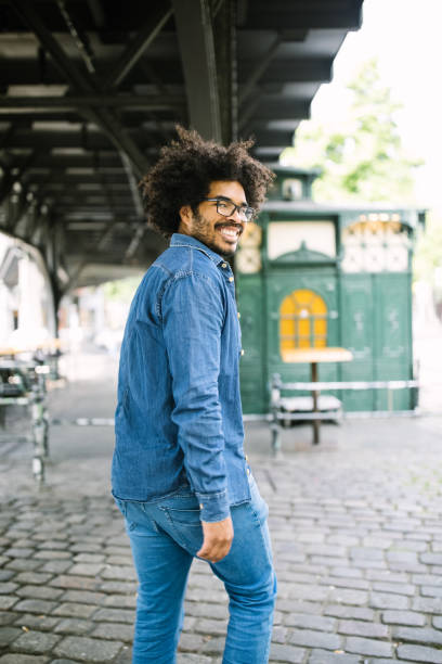 Smiling african man walking down the street