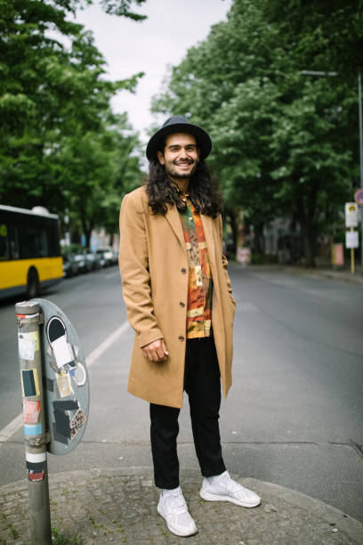 istock Smiling man standing in middle of the road 1007374936