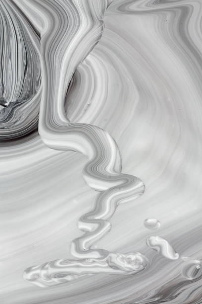 istock Mix of a white and black paint. 1007384684