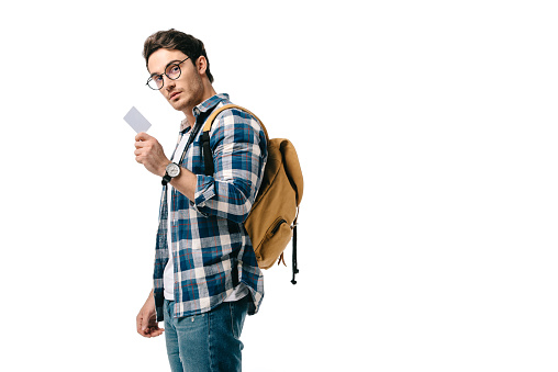 handsome student holding blank placard isolated on white