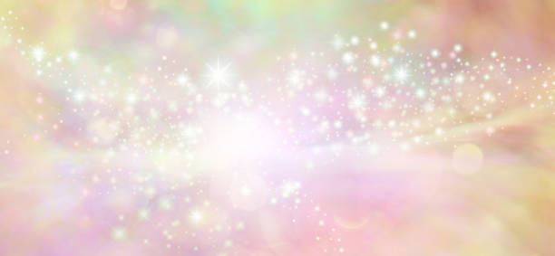 istock Peach starry glitter feminine toned bokeh background banner 1007395404