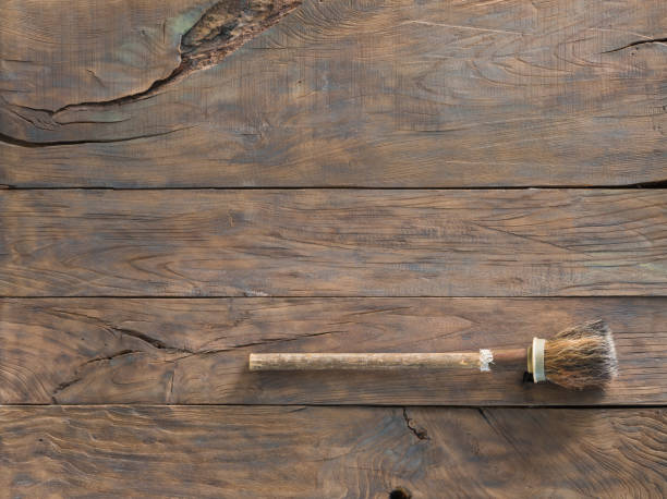 istock old paintbrush on a wooden wall 1007415360