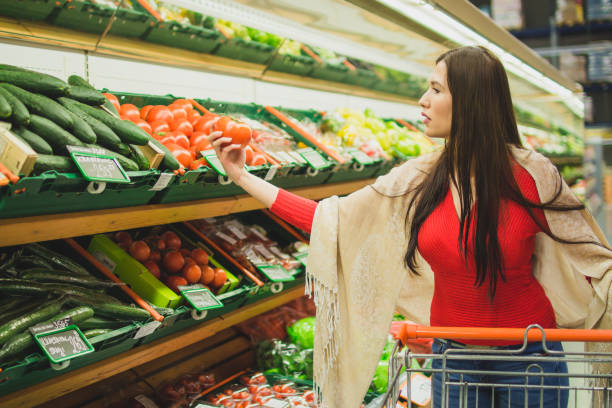istock Beautiful woman grocery shopping 1007415400