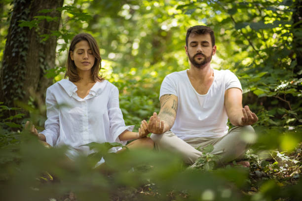 istock Yoga in nature. Couple goals. 1007415744