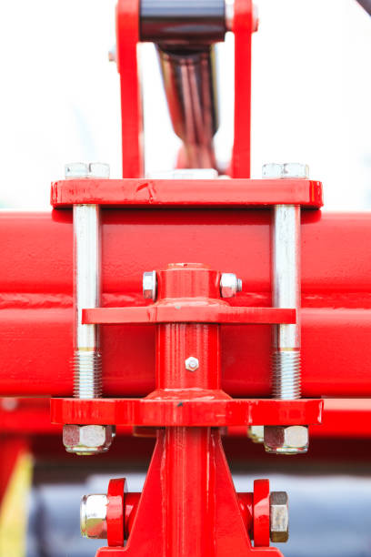 istock Screws on steel big machinery closeup 1007418998