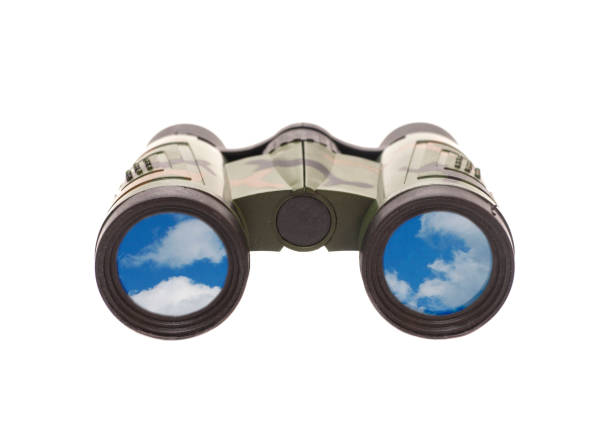 istock Camouflage binoculars with blue sky and clouds reflection in lenses 1007419440