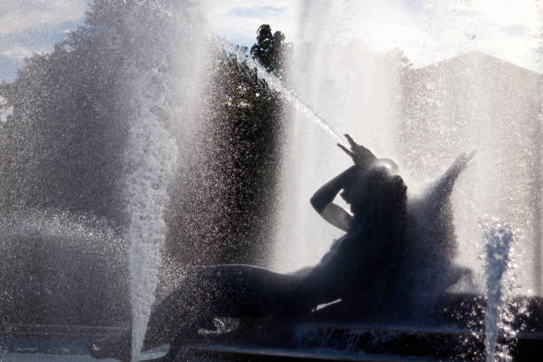Philadelphia, PA USA - July 20, 2018: Backlit image of The Schuylkill sculpture, part of the Swann Memorial Fountain at Logan's Circle in Philadelphia.