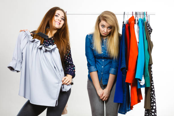 istock Women arguing during clothes shopping 1007422484