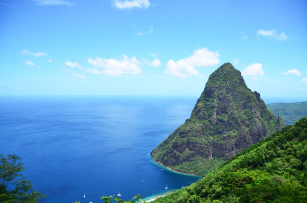 istock mountain peak out of deep blue sea 1007428704