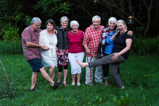 istock Group of seniors having fun posing outdoors at dusk. 1007445278