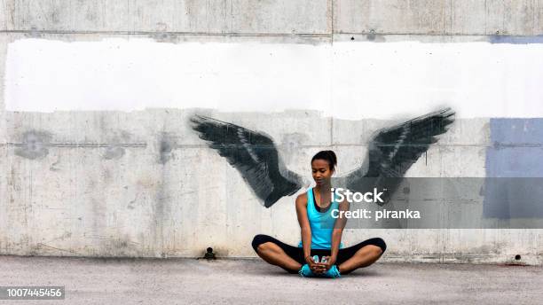 Female Jogger Stock Photo - Download Image Now - Graffiti, Animal Wing, Wall - Building Feature