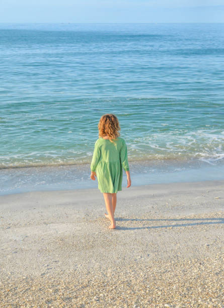 istock Little Girl, Big Ocean 1007448040