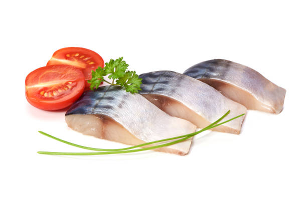 istock Mackerel with spices, herbs, tomatoes and peppers, isolated on white background 1007451236