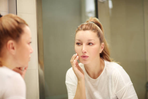 istock Magic anti-aging cream.Applying the cream 1007454592