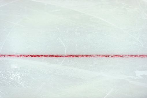 Red line on ice hockey ground. Fragment, hockey, concept