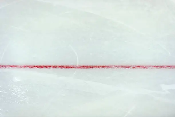 Photo of Red line on ice hockey ground. Fragment, hockey, concept