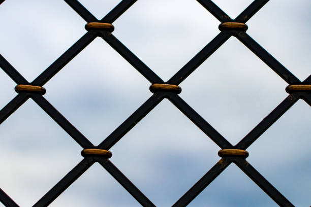 steel square grid against the sky close up.