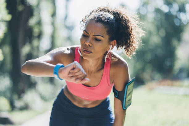 istock Sportswoman checking her smart watch 1007458698
