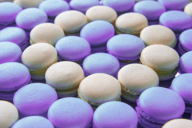 istock macaron french desert background. many white and blue macaroons. Textured. 1007458820