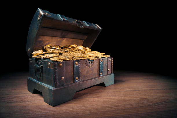 istock Treasure chest filled with gold coins 1007461126