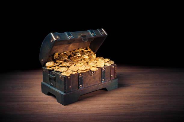 istock Treasure chest filled with gold coins 1007461156