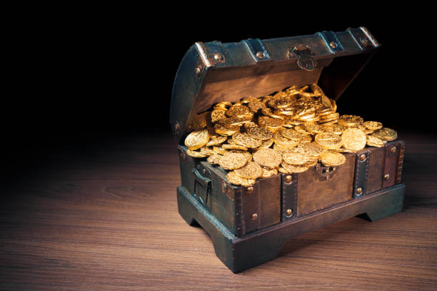 istock Treasure chest filled with gold coins 1007461196