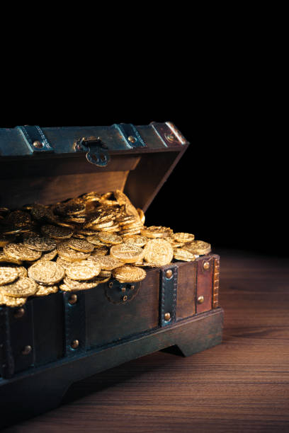 istock Treasure chest filled with gold coins 1007461272