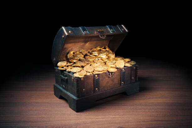 istock Treasure chest filled with gold coins 1007461328