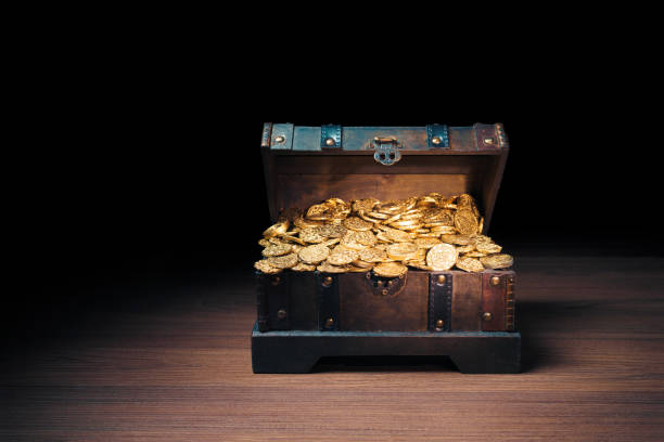 istock Treasure chest filled with gold coins 1007461330